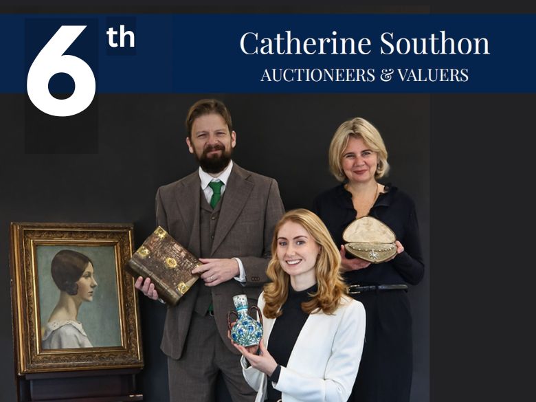Auctioneers posing with antiques