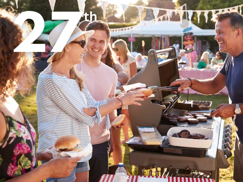 People at stalls in an outdoor fair