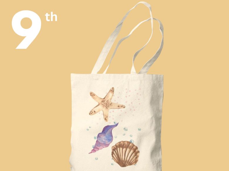 A tote bag decorated with shells