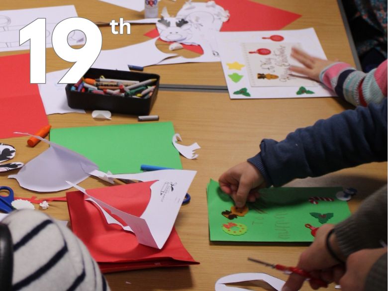 Children sticking coloured paper shapes